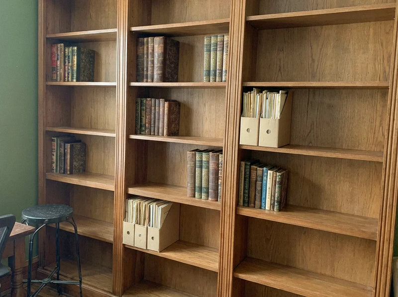 A clean, empty storeroom shelf after collection